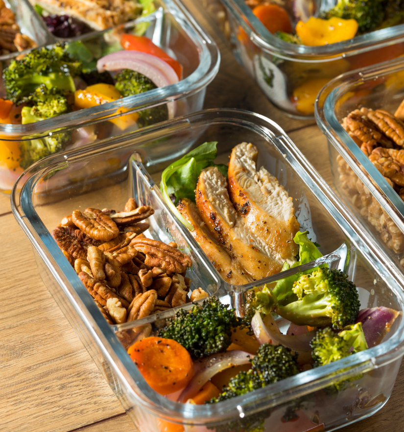 Freshly prepared healthy meals with chicken, vegetables, and nuts in meal containers, representing YWECARE’s meal preparation support for NDIS participants in Sydney.